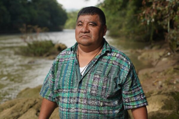 Bernardo Caal Xol stands in front of the Cahabon River. Cahabon, Alta Verapaz, Guatemala. October 27, 2022.