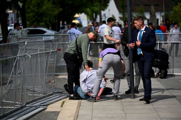 A person is detained after a shooting incident after Slovak government meeting in Handlova, Slovakia, May 15, 2024. REUTERS/Radovan Stoklasa