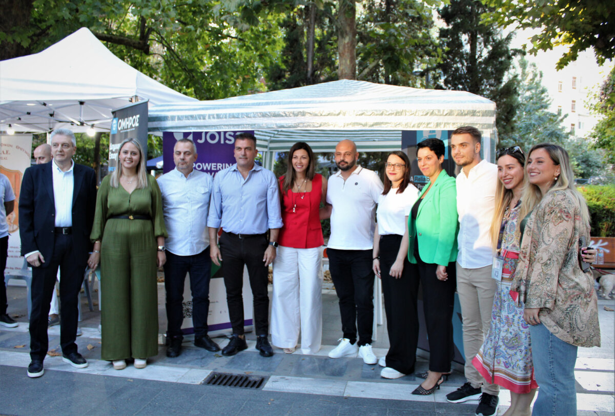 The Minister of Social Cohesion and Family Mrs. Sofia Zacharaki, Mayor of Larissa Mr. Athanasios Mamakos and other participants in front of the JOIST booth at the 4th Larissa Youth Festival.