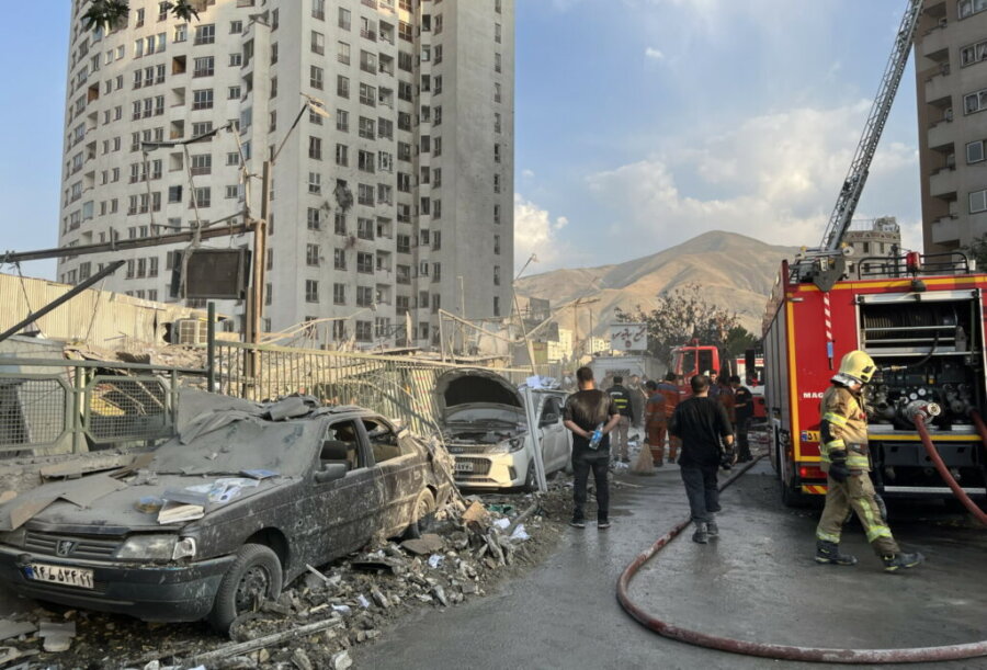 epaselect epa12172720 Fire fighters work outside a building that was hit by Israeli air strikes north of Tehran, Iran, 13 June 2025. Israel confirms it has launched strikes on Iran's 'nuclear program' as blasts are heard across the country. The strikes are part of Operation Rising Lion, Israel's Prime Minister Benjamin Netanyahu said, adding Iran was a threat to "Israel's very survival".  EPA/ABEDIN TAHERKENAREH