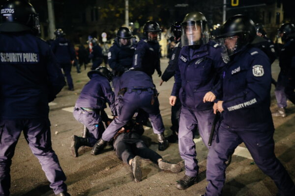 epa12563308 Riot police officers detain a protester during a rally against the 2026 national budget in Sofia, Bulgaria, 01 December 2025. The demonstration was organized by opposition parties to challenge the government's proposed financial plan. EPA/BORISLAV TROSHEV
